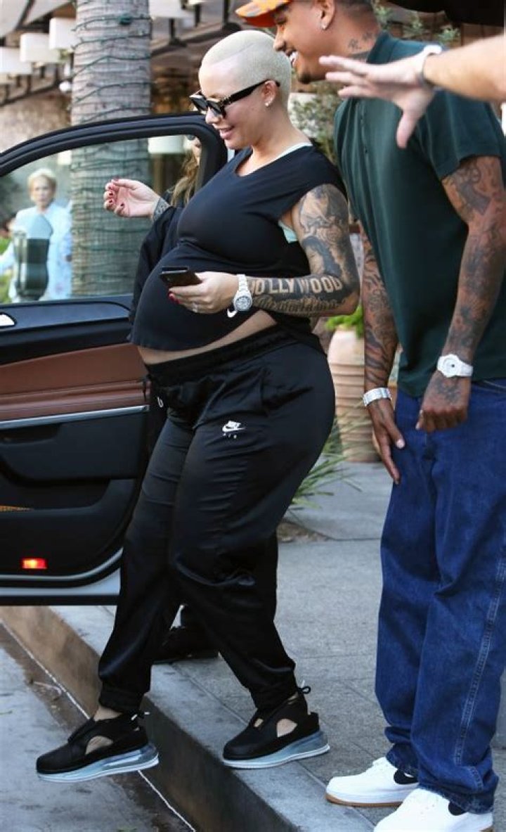 Pregnant Amber Rose Cuddles Up With Boyfriend Alexander ‘AE’ Edwards in Beverly Hills