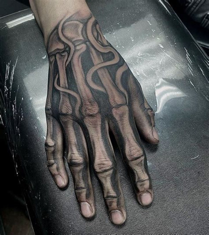 What does a skeleton hand and rose tattoo mean?